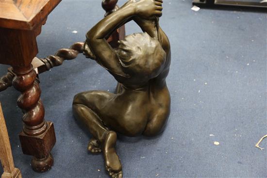 After Enzo Plazzota. A bronze model of a seated nude woman, height 25in.